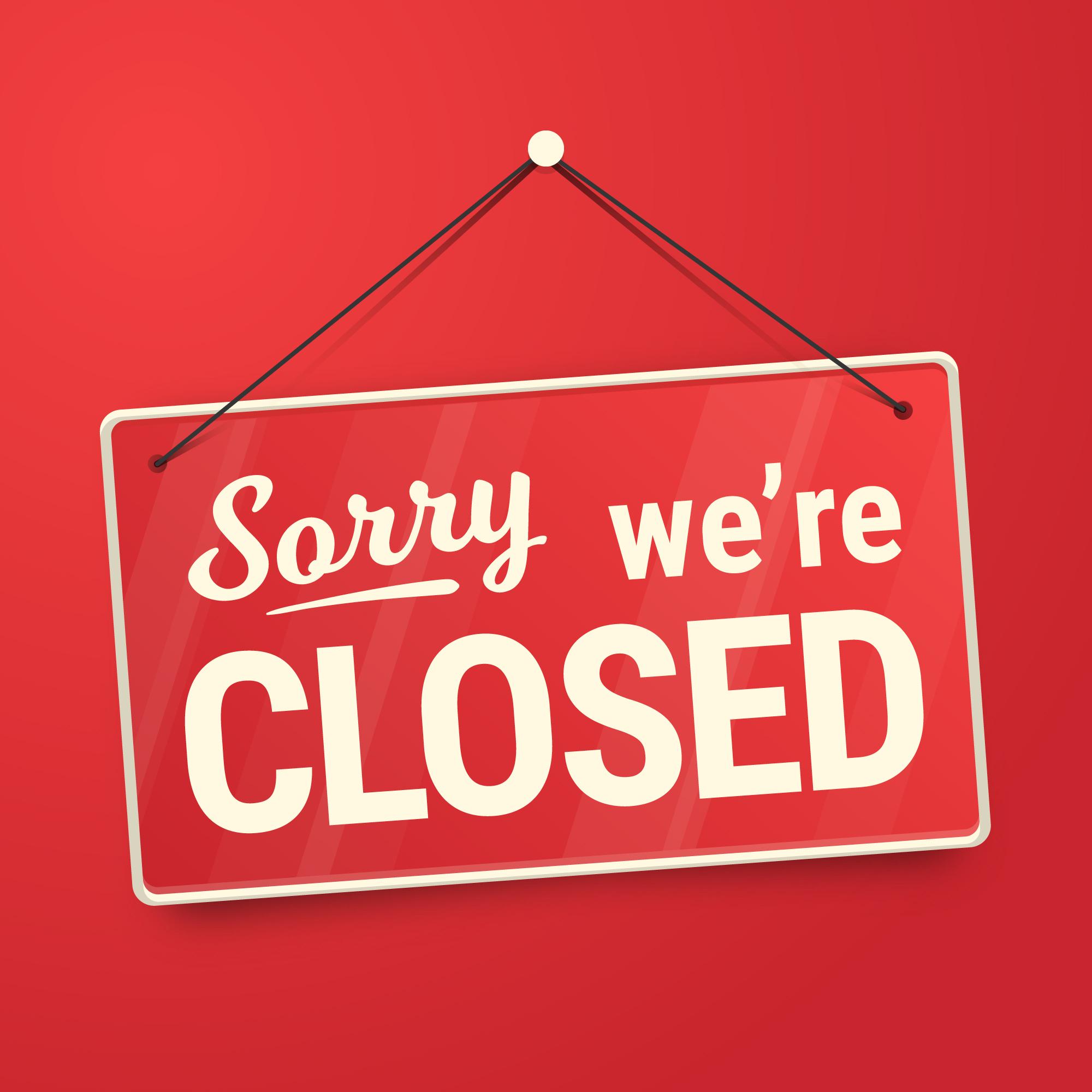 Sign with "Sorry we're closed" on a red background