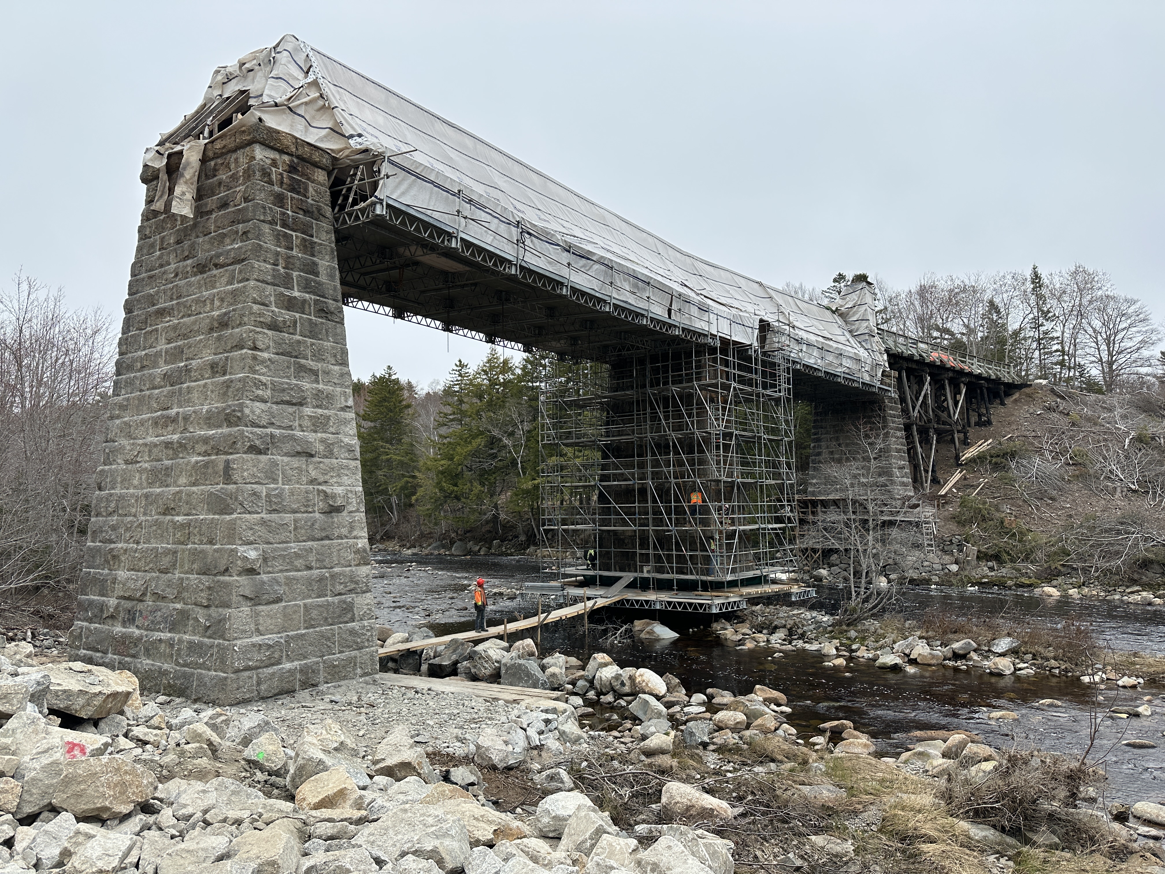 Scaffolding around center granite pier of Gold River Trail Bridge