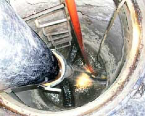Open manhole with a ladder 